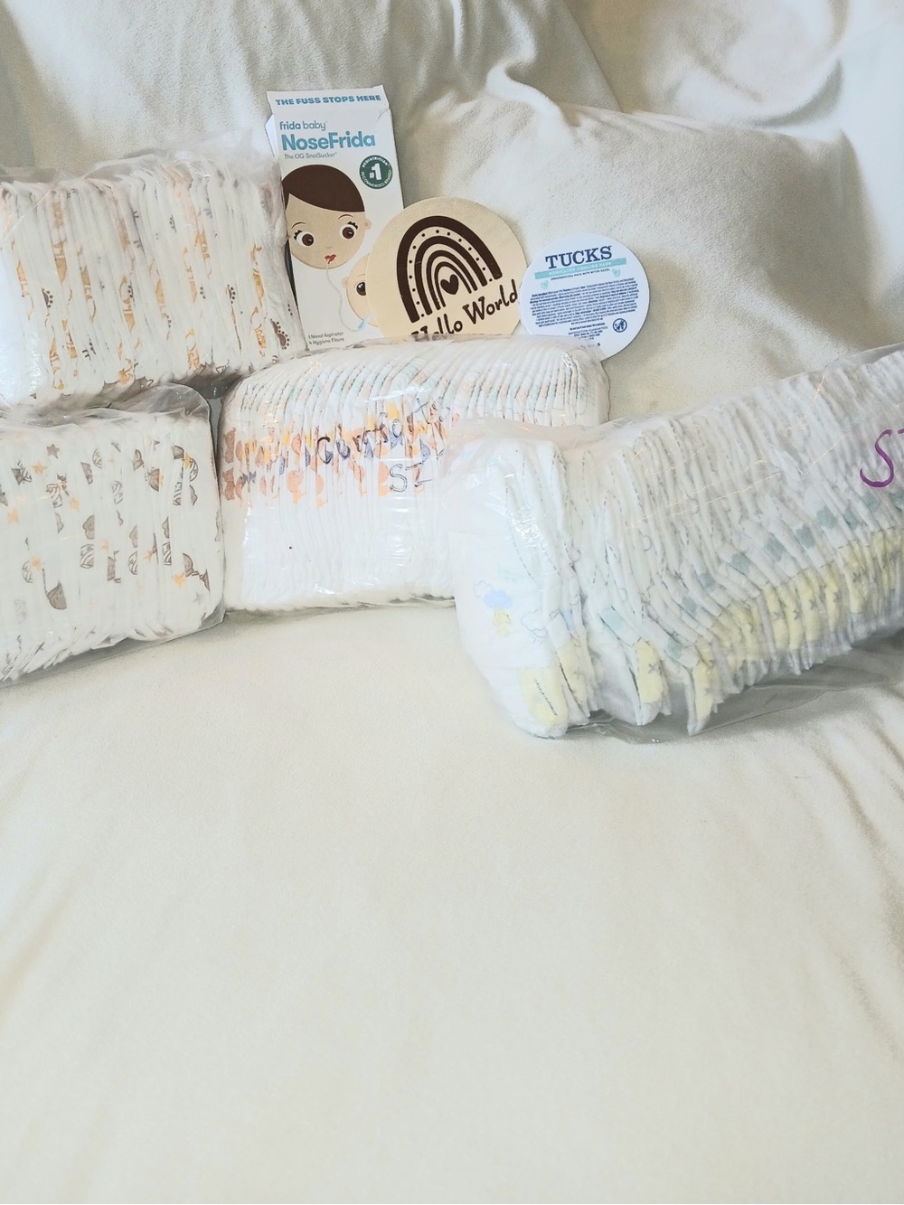 60+ diapers and NoseFrida Baby Care Pack with Size 1 & 2 Diapers & wooden plaque